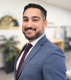 General Counsel Aaron Zaheen smiling warmly at the camera.